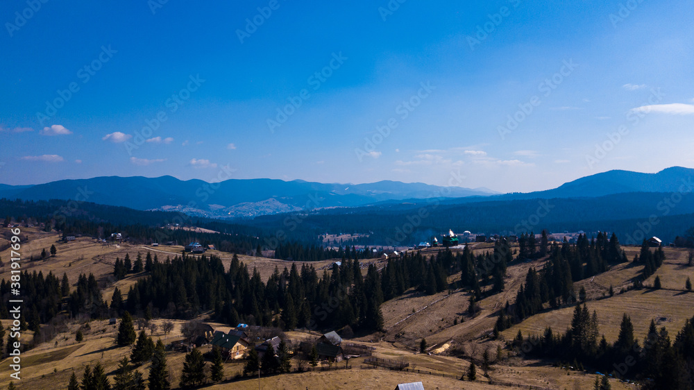 Alpine village settlement of a house on top of a mountain aerial photo Carpathians Ukraine.