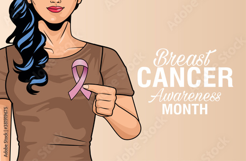 breast cancer awareness month lettering with woman lifting pink ribbon