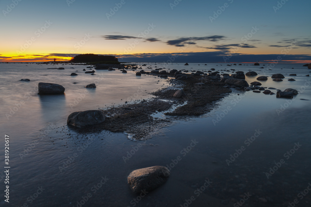Twilight sunset at summer. Baltic sea coast with boulders. Twilight sunset at summer. Baltic sea coast with boulders.