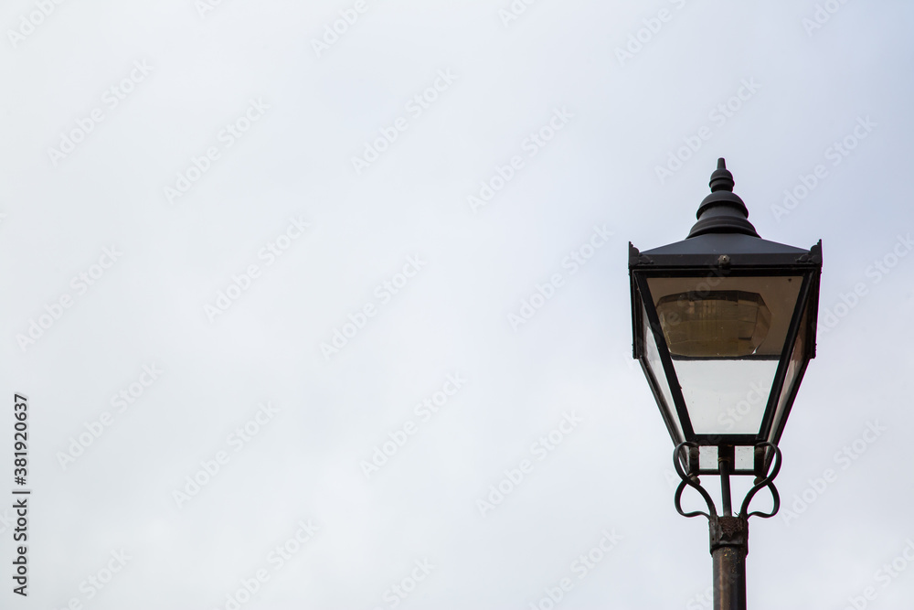 A victorian street lamp with copy space to the left