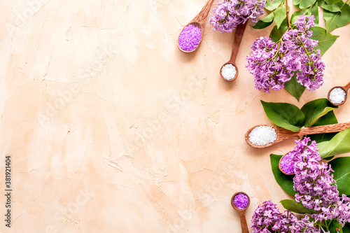 Sea salt spa set with pink lilac flowers. Top view