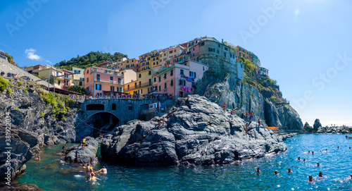 Village of Manarola, Cinque Terre coast of Italy. magnificent seen from the Italian coast, Manarola is a small town in Liguria, in the north of Italy - aerial view with a drone - travel concept