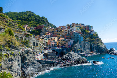 Village of Manarola, Cinque Terre coast of Italy. magnificent seen from the Italian coast, Manarola is a small town in Liguria, in the north of Italy - aerial view with a drone - travel concept