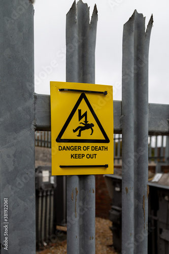 a sign stating danger of death outside an electricity substation