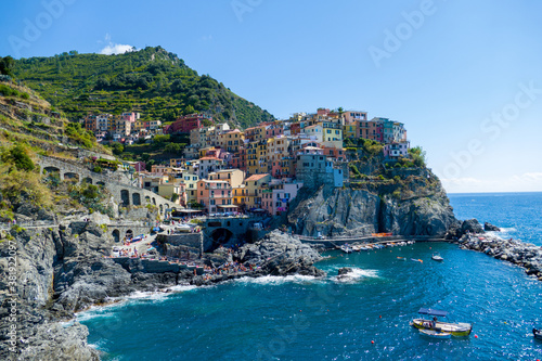 Village of Manarola, Cinque Terre coast of Italy. magnificent seen from the Italian coast, Manarola is a small town in Liguria, in the north of Italy - aerial view with a drone - travel concept