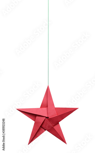 A hanging red origami paper star with string photo