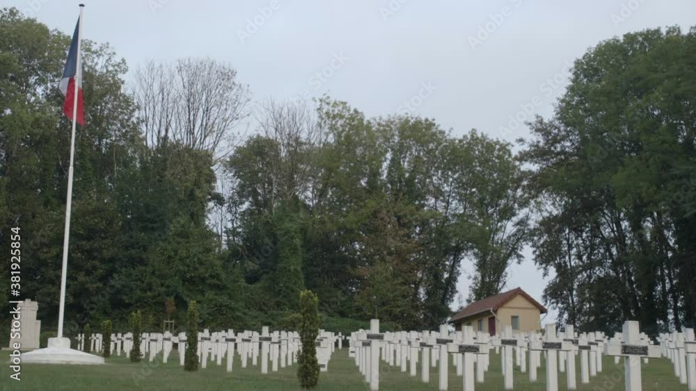War World 1 graveyard in France. Medium shot with the graves and a french flag. War World 1 graveyard in France. Medium shot with the graves and a french flag.