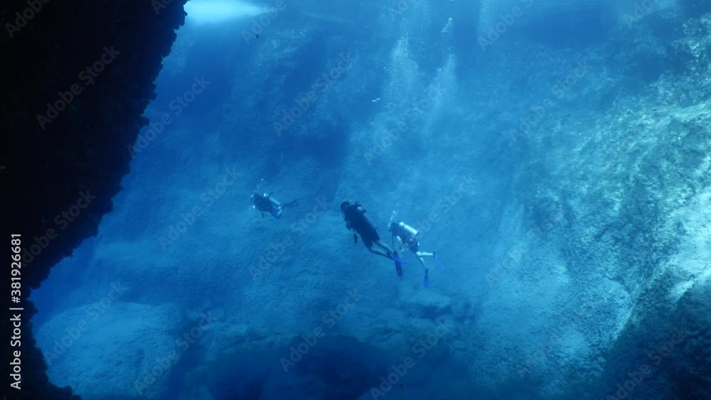 scuba divers exploring the reefs and underwater with rocks ocean scenery enjoying topography mediterranean sea scuba divers exploring the reefs and underwater with rocks ocean scenery enjoying topography mediterranean sea