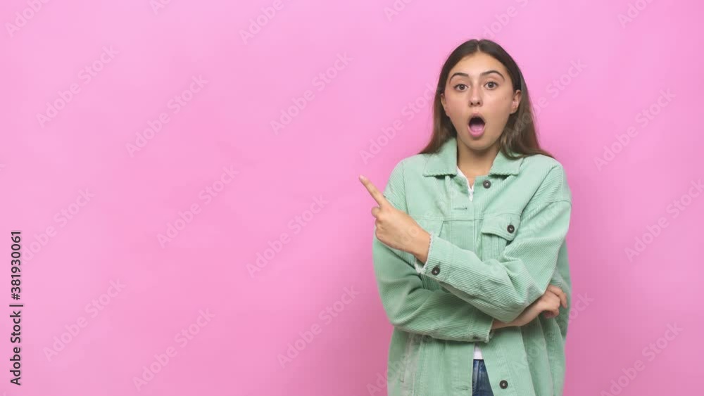 Young caucasian woman pointing to the side Young caucasian woman pointing to the side