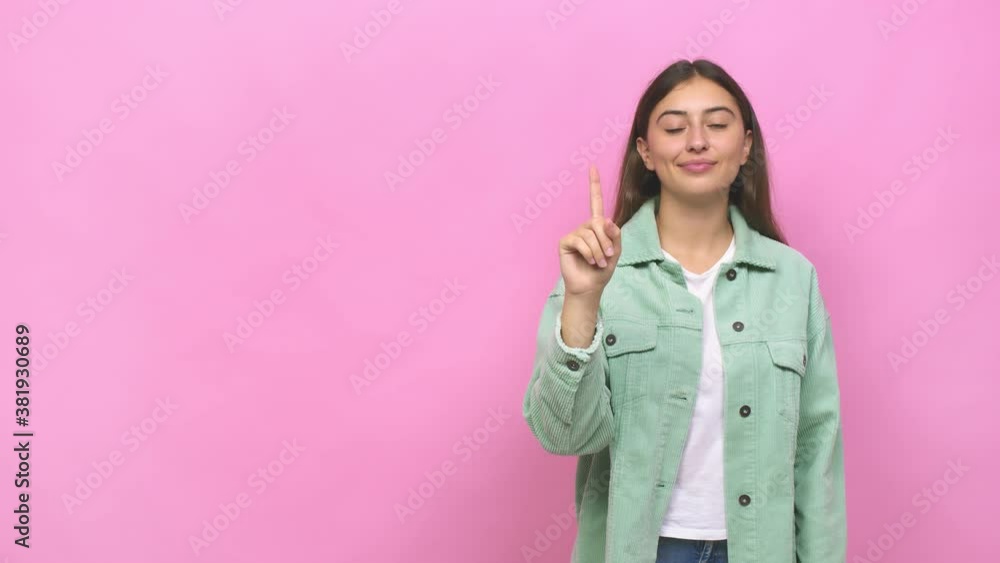 Young caucasian woman showing number one with finger Young caucasian woman showing number one with finger