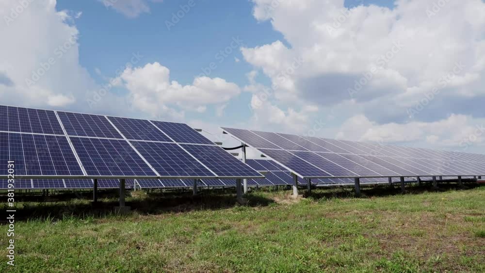 Solar farm on green field. Modern complex with many solar panels. Alternative energy. Solar farm on green field. Modern complex with many solar panels. Alternative energy.