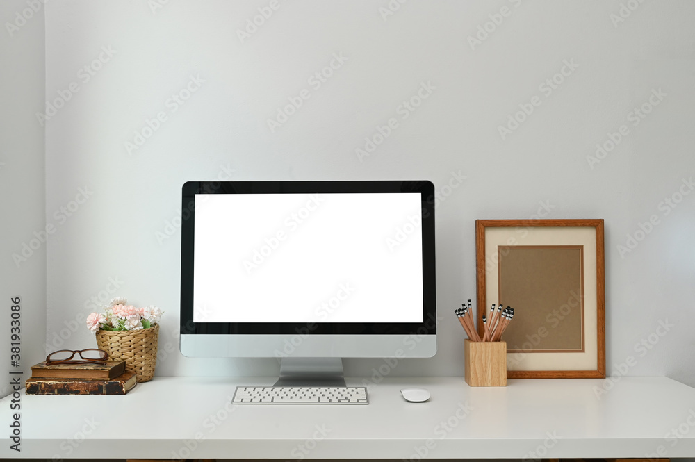 Mock up of blank computer pc on the desk on white table in modern living room. Mock up of blank computer pc on the desk on white table in modern living room.