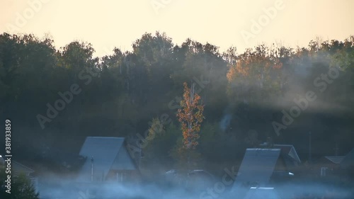 Timelapse of misty sunset in the village