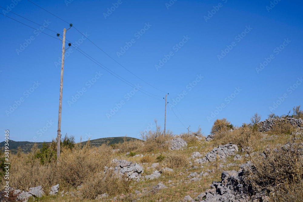 ligne électrique et poteau en bois. power line and wooden pole. ligne électrique et poteau en bois. power line and wooden pole.