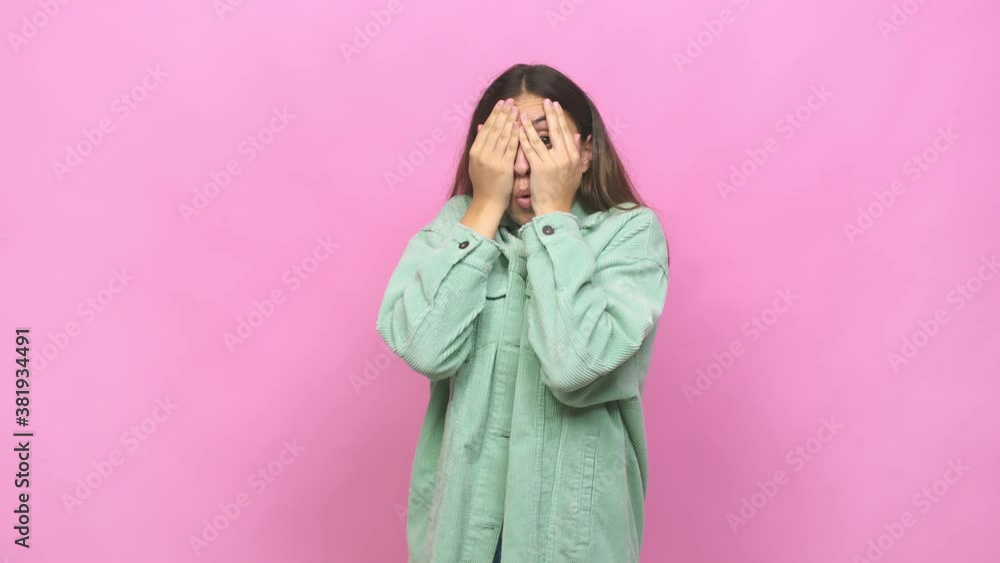 Young caucasian woman blink through fingers frightened and nervous Young caucasian woman blink through fingers frightened and nervous