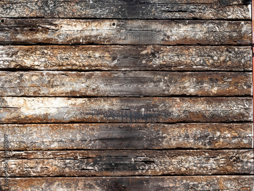 Rustic, textured, timber sleepers piled on top of each other as a background