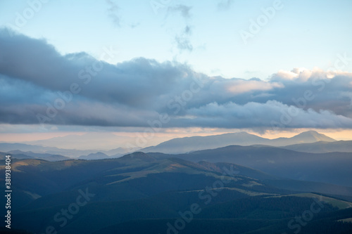 Fototapeta Naklejka Na Ścianę i Meble -  view of sunset above mountains peak