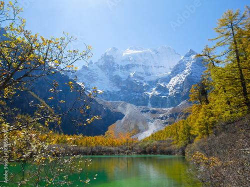 Pearl Lake or Zhuoma La Lake and snow mountain in autumn