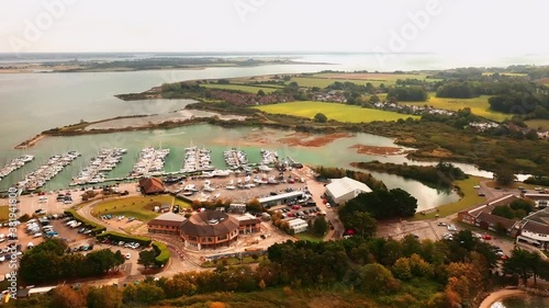 Aerial Video of Northney Marina situated on the shore of Hayling Island in Langstone Harbour. photo