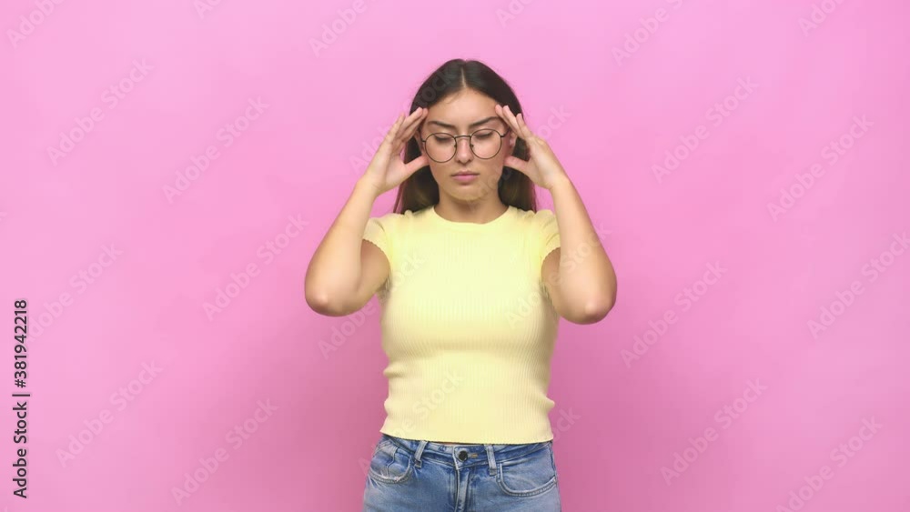 Young caucasian woman touching temples and having headache Young caucasian woman touching temples and having headache