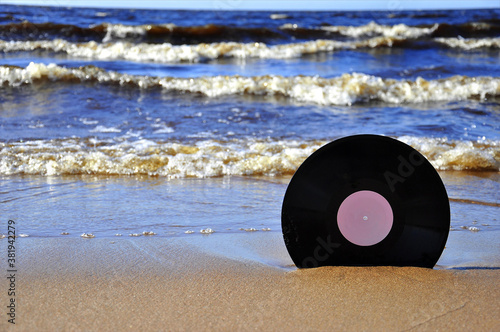 Vinyl record on the sand.