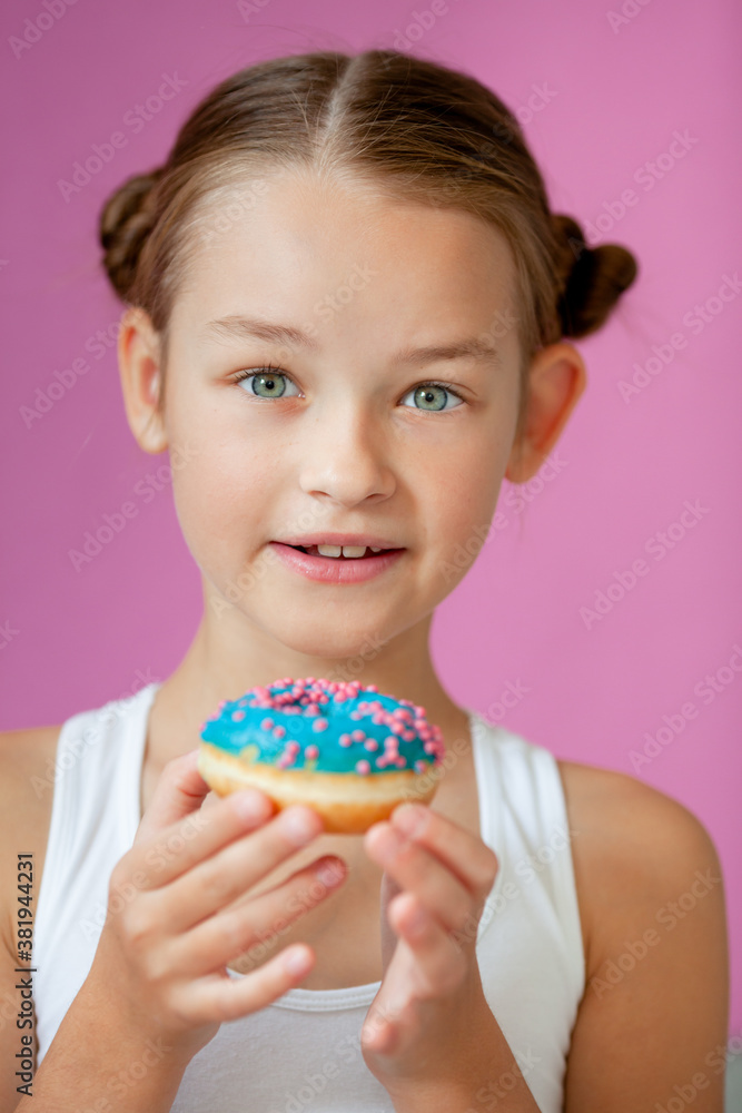 cute girl holding an appetizing glazed donut in her hands cute girl holding an appetizing glazed donut in her hands