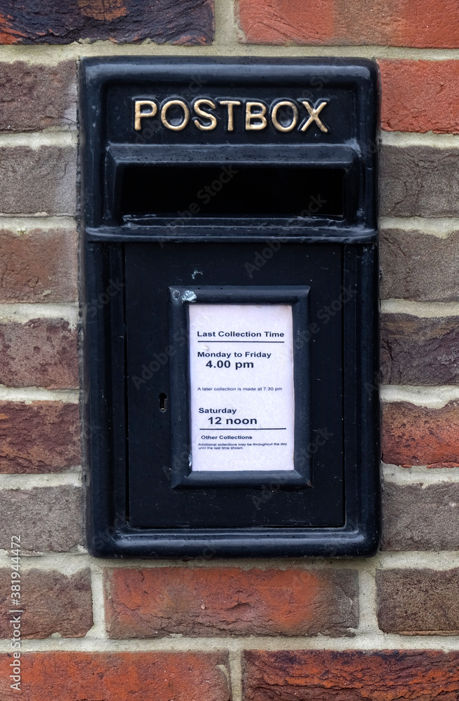 Black mail box inserted in a brick wall. Black mail box inserted in a brick wall.