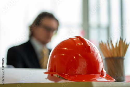 Caucasian engineer with safety hard hat meeting in constructuion site.  social distancing new normal concept. photo