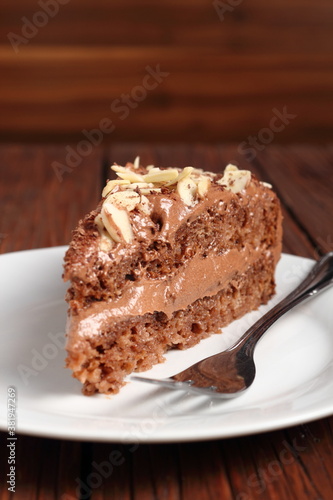 Wallpaper Mural Chocolate sandwich cake garnished with flaked almonds Torontodigital.ca