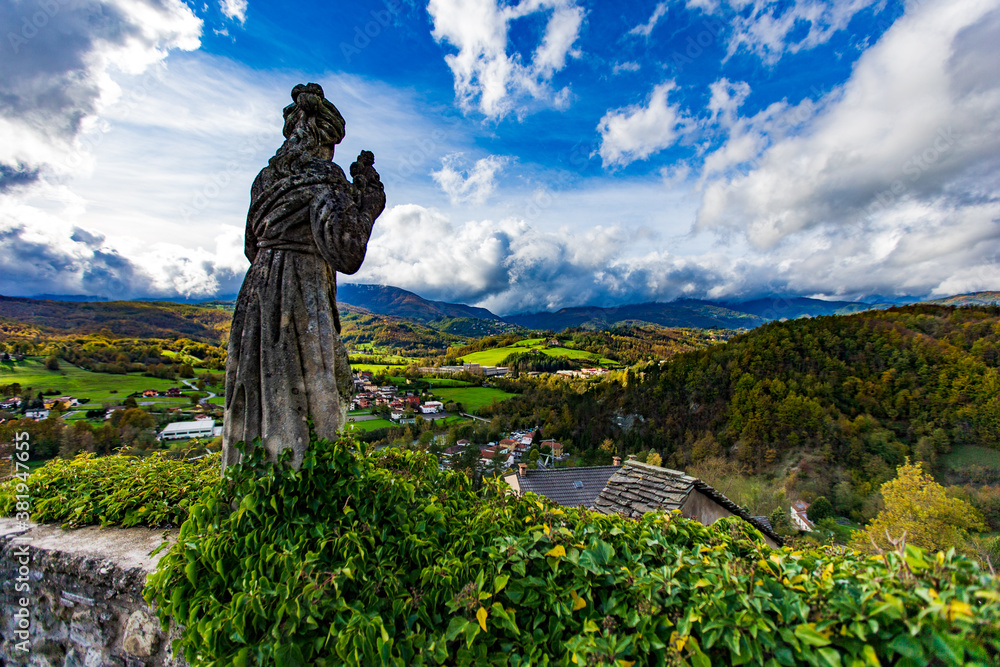 statue of a person in the mountains
