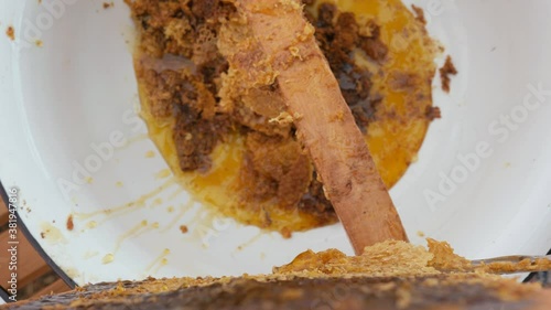 Wallpaper Mural Girl beekeeper Unseal Honeycomb. A close-up knife opens honeycomb with honey on frame made of beehive. Torontodigital.ca