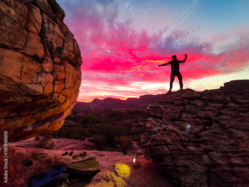 Silhouette of Man on Mountain top Summit Expressing mindfulness & Freedom for Life. Clouds, Epic Red Sky and boulders with Scenic View from the Top, Rocklands, Cederberg, South Africa , Rock Climbing photo