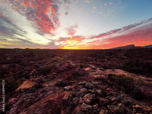 African Sunrise / Sunset over Rocky Meadow in the Rocklands, Cederberg, South Africa, Colourful Sky, colorful clouds, horizon panorama. 