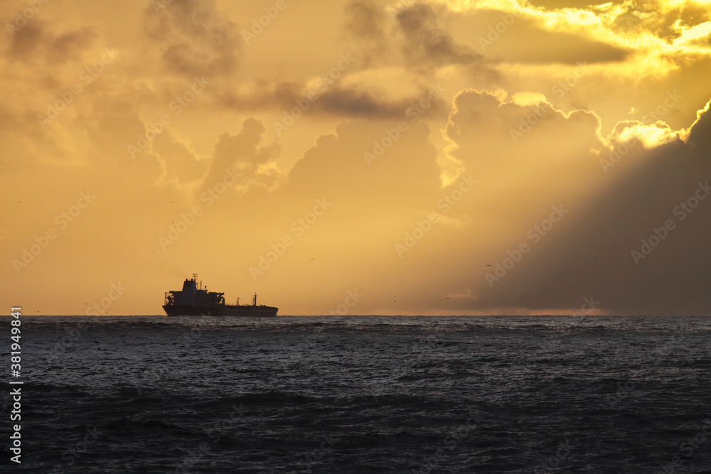 Oil tanker at sunset