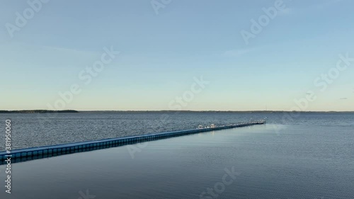 Wallpaper Mural Berth with seagulls sitting and taking off on the sea shore. Birds Gulls sitting on moorage. Flock of seagulls fly over ocean and beach in daytime. General plan of plastic crossing. Old Wood Pier 4k Torontodigital.ca