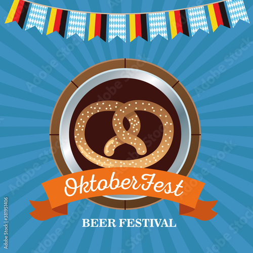 happy oktoberfest celebration with pretzel in wooden frame