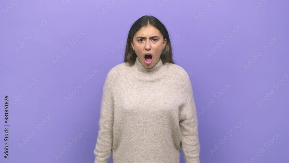 Young caucasian woman screaming very angry and aggressive Young caucasian woman screaming very angry and aggressive