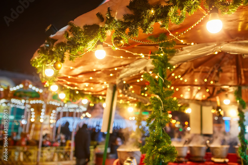 Christmas decorations on the street, colorful holiday bokeh lights, city night illumination