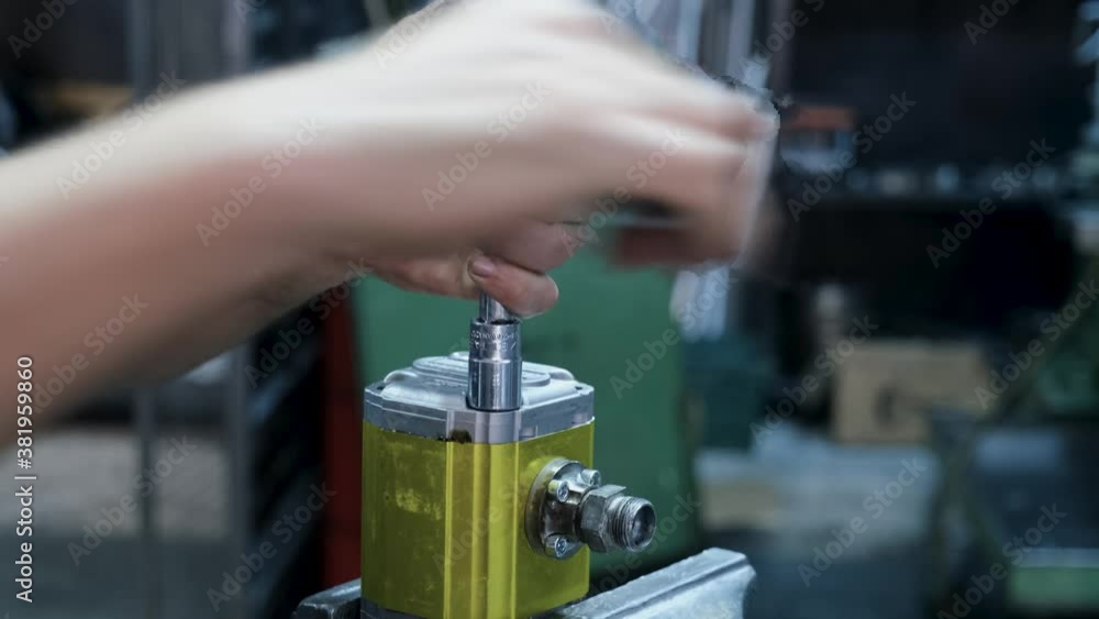 Man tightening nut with torque wrench
Man tightening nut with torque wrench