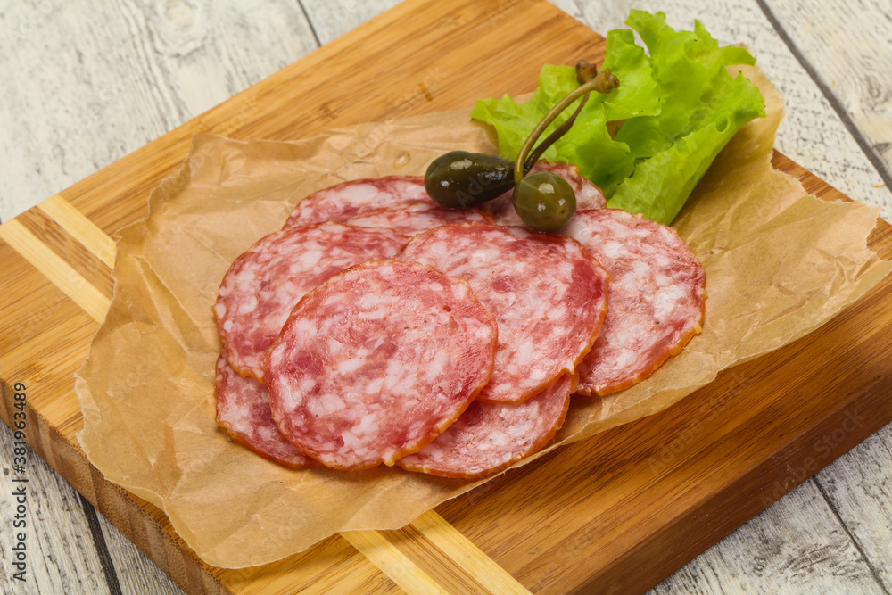 Spanish Salchichon sausage with salad Spanish Salchichon sausage with salad