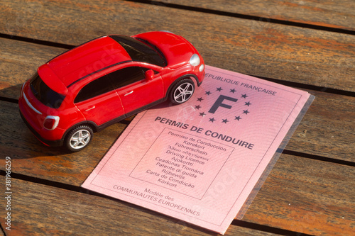 French driving license and toy car