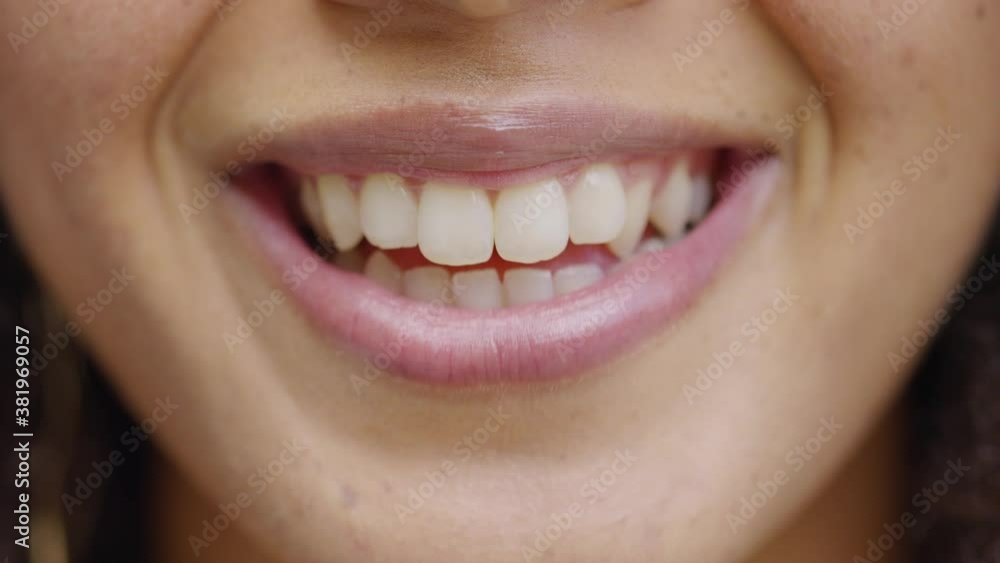 Close up shot of young black female talking to camera with a cheerful expression Close up shot of young black female talking to camera with a cheerful expression