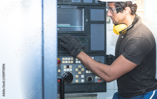 Engineers, Technicians Caucasian man is setting up the system of the machine To work at full capacity, and machine operation which controlled by electric laser system