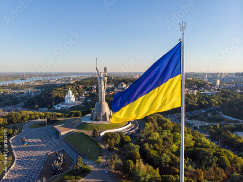 Aerial Drone Flyby Shot in Kyiv - Biggest National flag of Ukraine. Aerial view. Spivoche Pole  Kiev