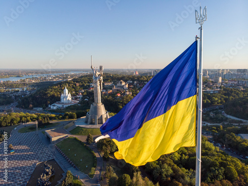 Aerial Drone Flyby Shot in Kyiv - Biggest National flag of Ukraine. Aerial view. Spivoche Pole, Kiev