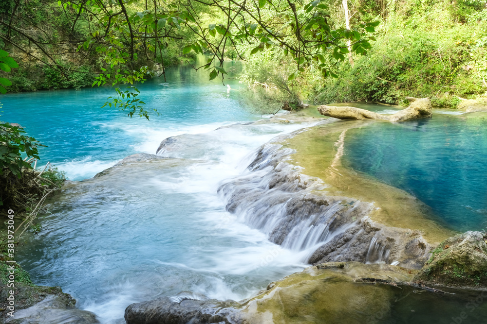 small waterfalls produced by the river elsa in the fluvial park of colle di val d'elsa tuscany italy small waterfalls produced by the river elsa in the fluvial park of colle di val d'elsa tuscany italy