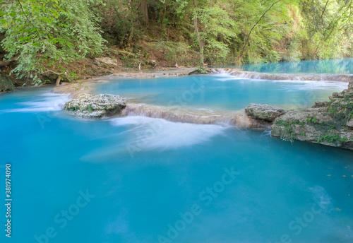 Tiny waterfalls produced elsa river in the colle di val d'elsa river park tuscany italy