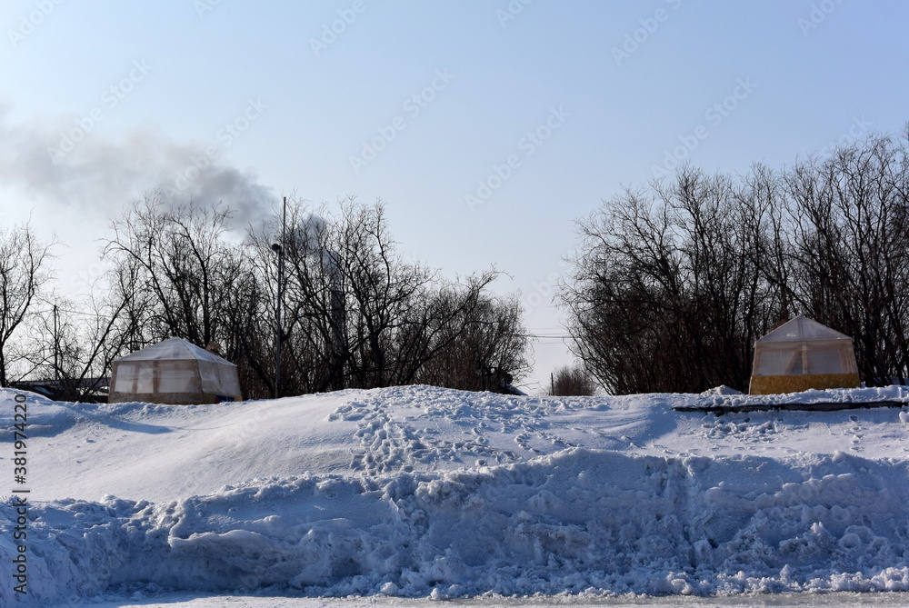 snow-covered Park, North of Russia spring month of may clear sky and sun