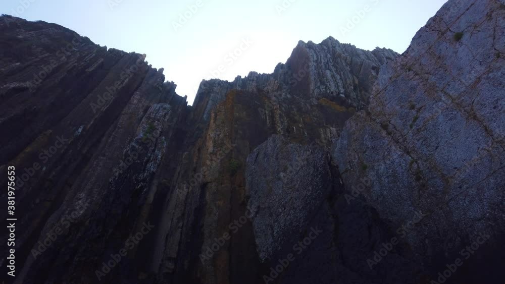 Amazing cliff in a sandy beach. Rock formation Amazing cliff in a sandy beach. Rock formation