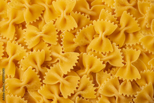 Farfalle - one of the types of traditional Italian pasta. Macaroni products, pasta as a background, for advertising, blogging, culinary publications